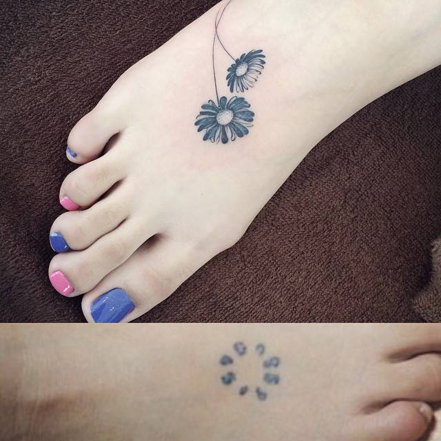 Black And Grey Daisy Flowers Tattoo On Right Foot