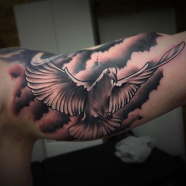 Black And Grey Flying Dove Tattoo On Sleeve