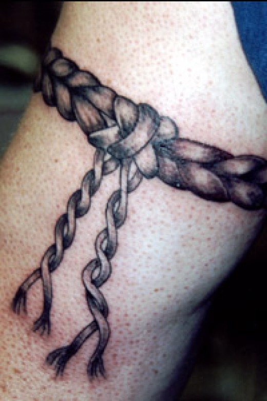 Black And Grey Rope Tattoo On Bicep