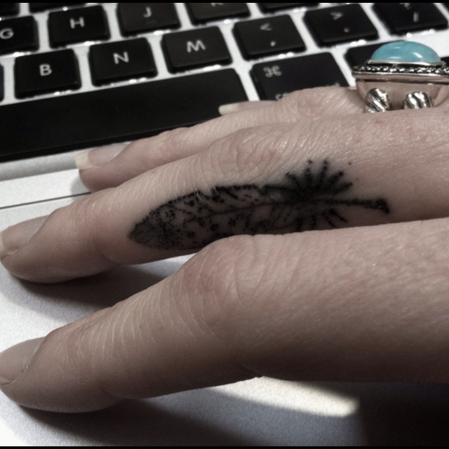 Black And White Feather Tattoo On Side Finger