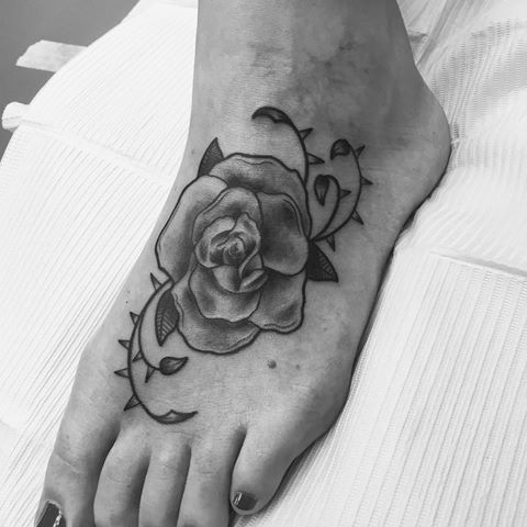 Black And White Rose Tattoo On Foot