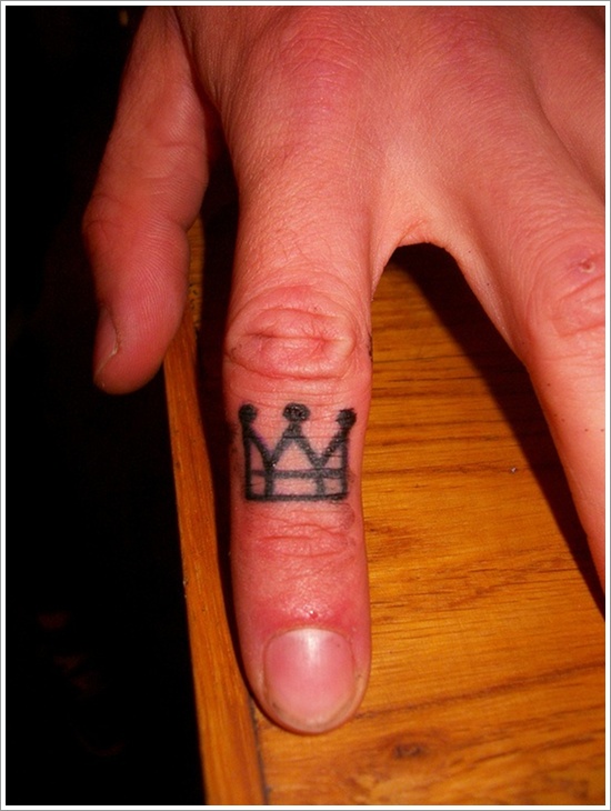 Black Ink Crown Tattoo On Finger