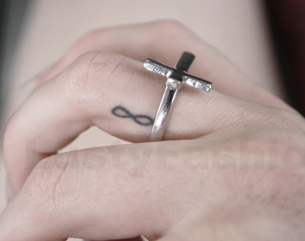 Black Ink Infinity Tattoo On Side Finger