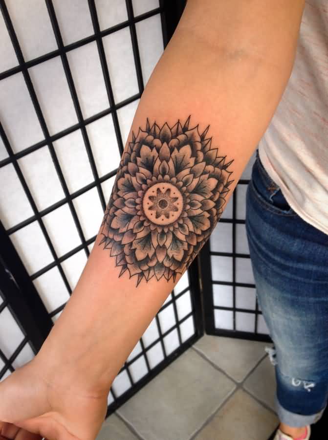 Black Ink Mandala Flower Tattoo On Forearm
