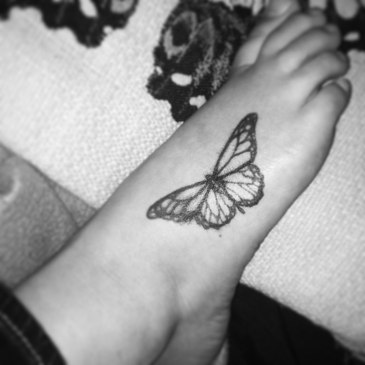 Black Monarch Butterfly Tattoo On Foot