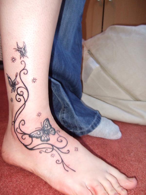 Black Stars Butterflies Tattoo On Ankle And Foot For Girls