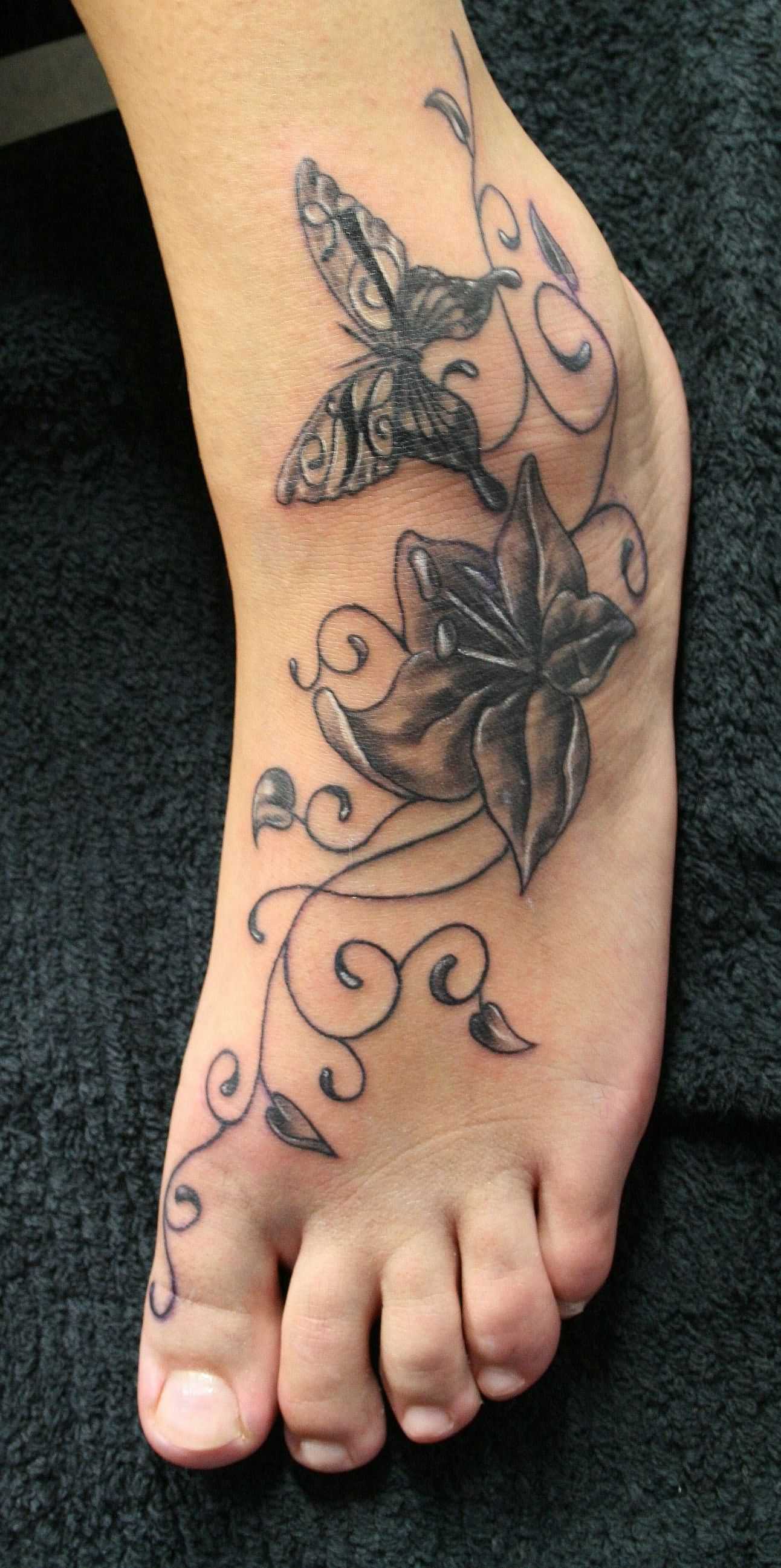 Black Stylish Butterfly And Flower Tattoo On Foot