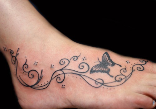 Black Swirly Butterfly Tattoo On Foot