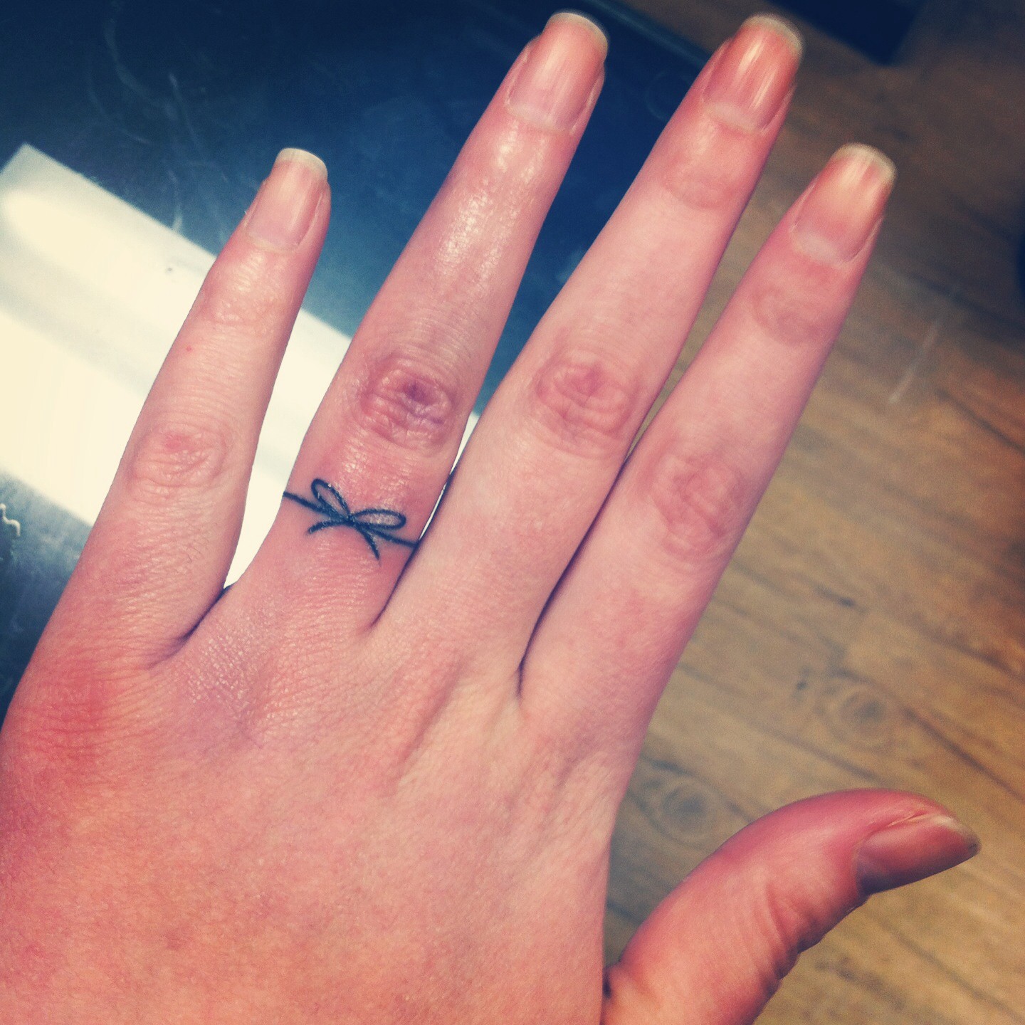 Black Thread Bow Ring Tattoo On Finger For Girls