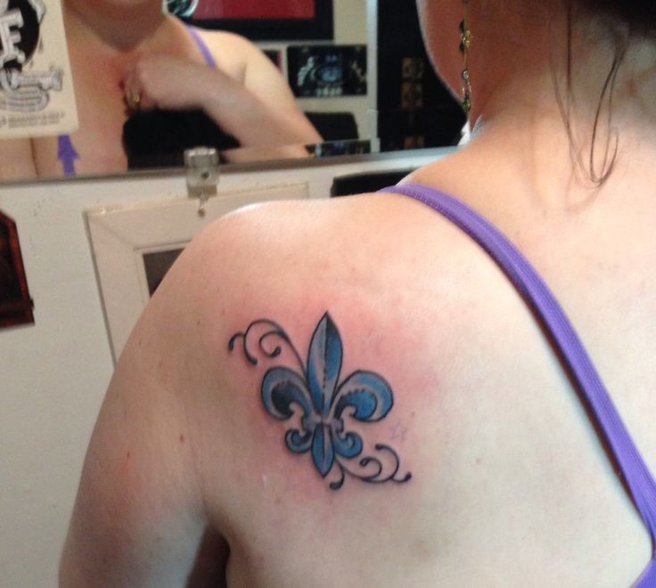 Blue De Lis Tattoo On Back Shoulder