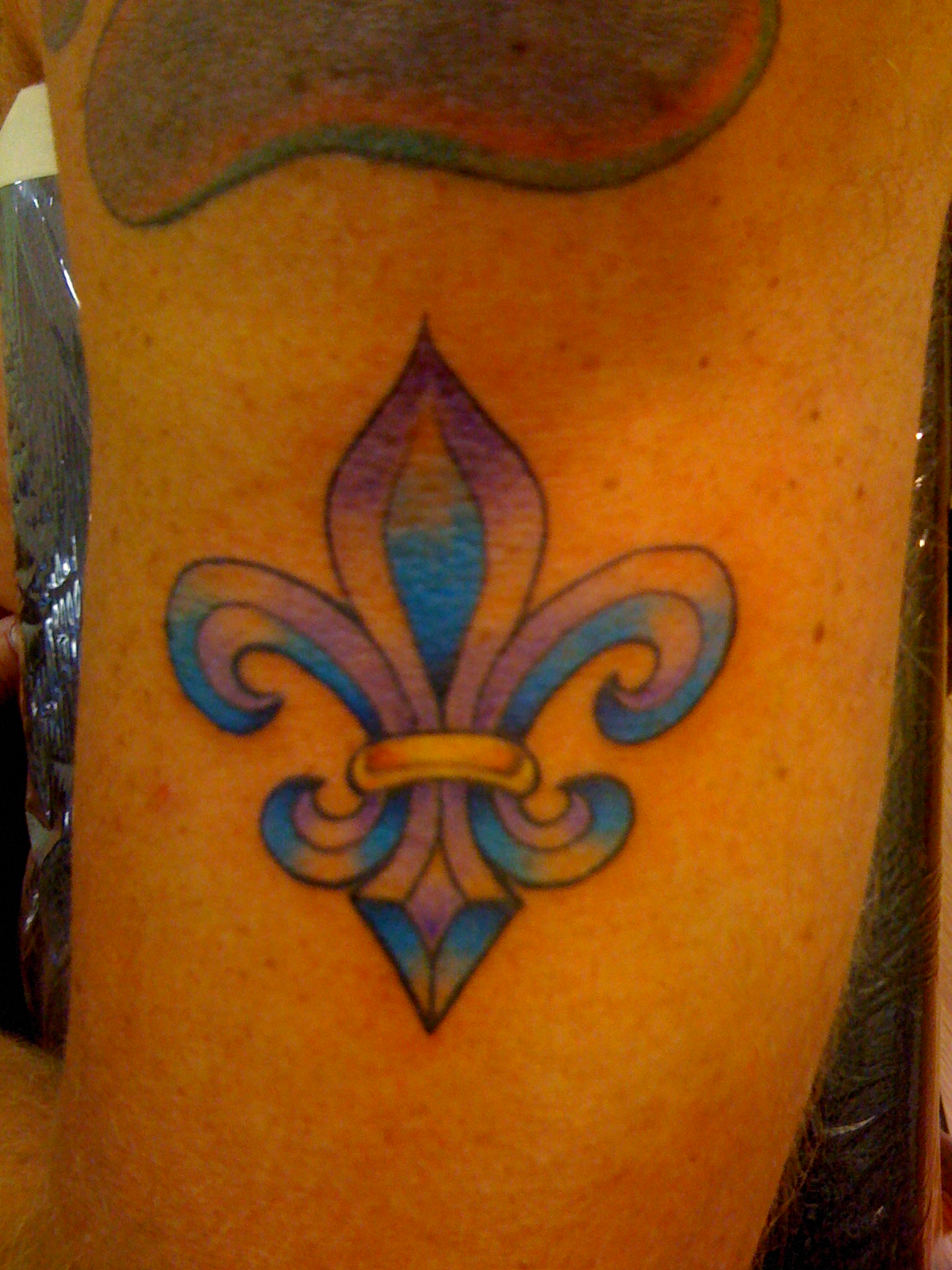 Blue Fleur De Lis Tattoo On Half Sleeve