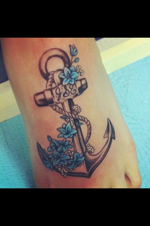 Blue Flowers Anchor Tattoo On Foot