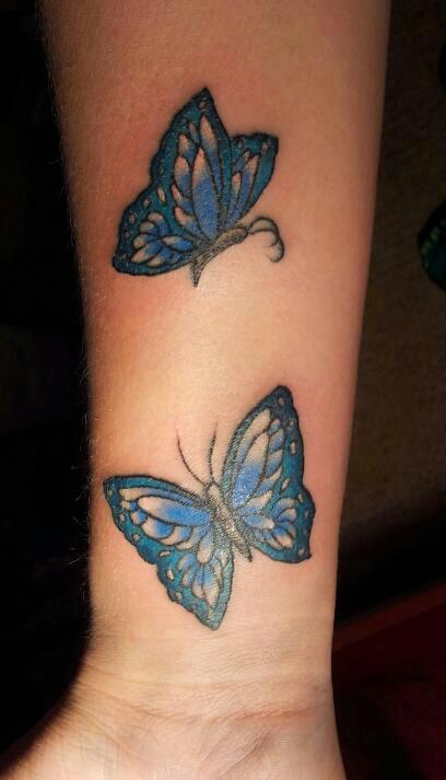 Blue Ink Butterfly Tattoo On Right Arm