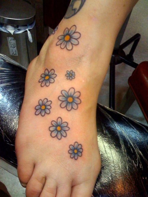 Blue Ink Daisy Flowers Tattoo On Right Foot