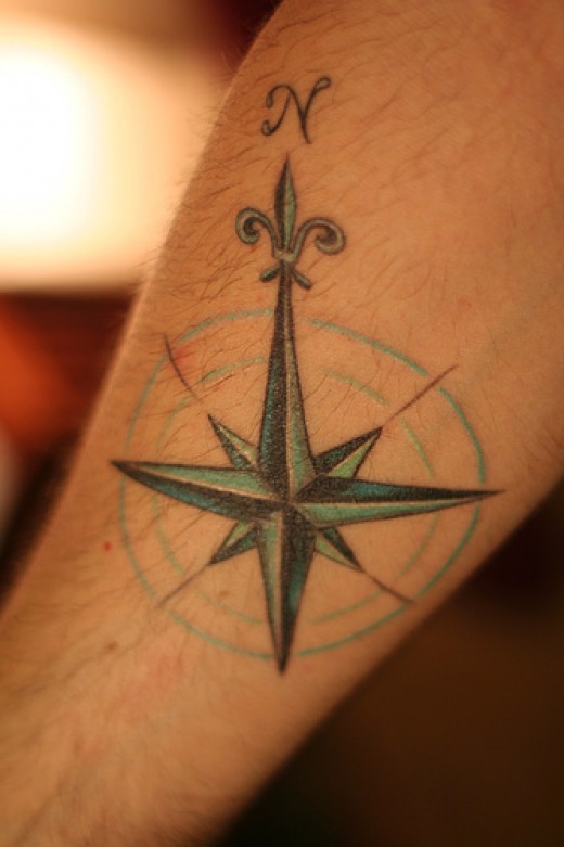 Blue Ink Flue De Lis Compass Tattoo On Arm Sleeve