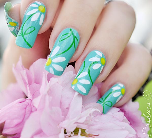 Blue Nails With White Spring Flowers Nail Art