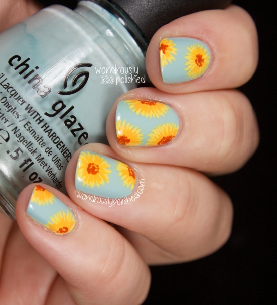 Blue Nails With Yellow Spring Flowers Nail Art