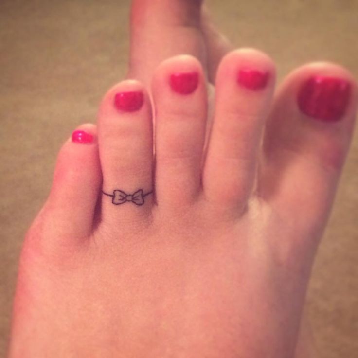 Bow Toe Ring Tattoo On Girl Foot