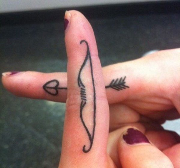 Bow and Arrow Tattoos On Side Fingers