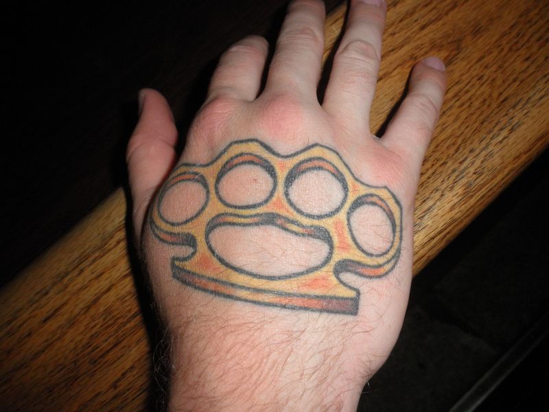 Brass Knuckle Tattoo On Hand