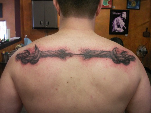 Broken Rope Tattoo On Man Upper Back
