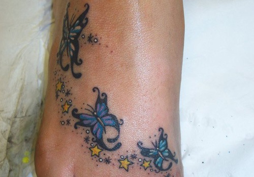 Butterflies With Yellow Stars Tattoo On Foot