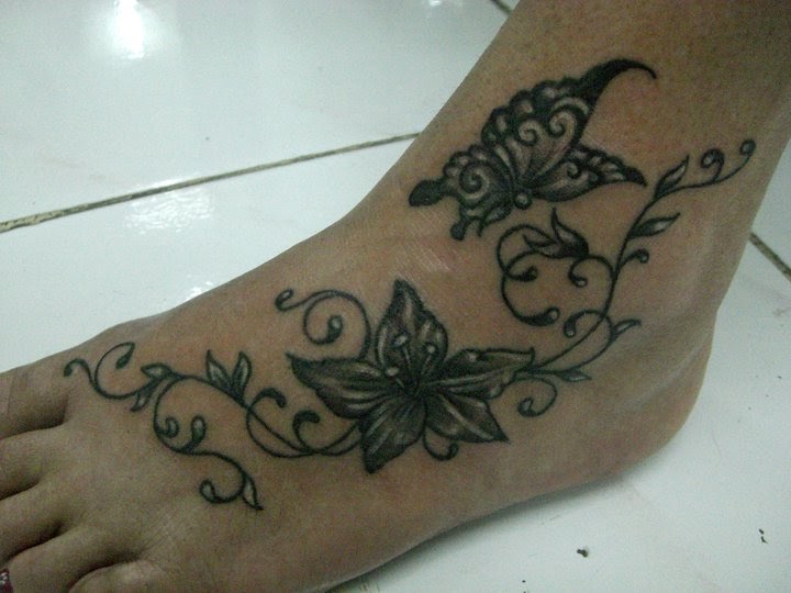 Butterfly And Flowers On Foot Tattoo