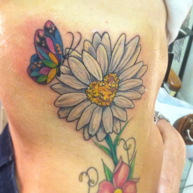 Butterfly With Daisy Flower Tattoo On Side Rib