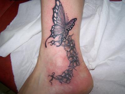 Butterfly With Grey Flowers Tattoo On Ankle