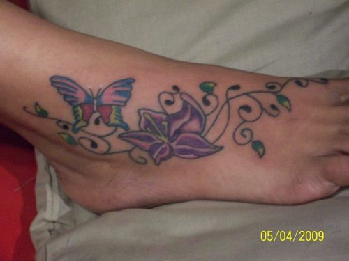 Butterfly With Purple Flower Tattoo On Foot