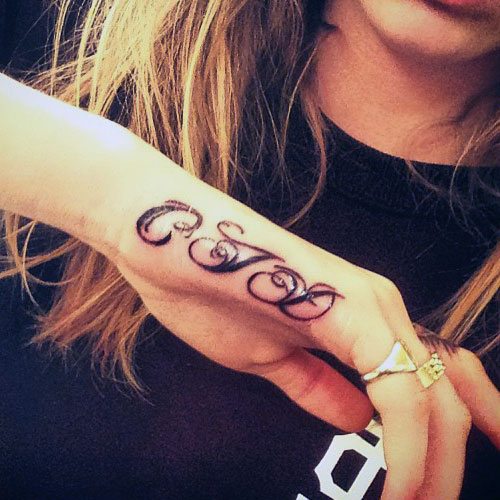 Cara Delevingne CJG Side Hand Tattoo