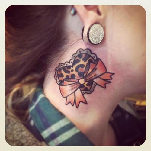 Cheetah Heart With Bow Tattoo On Side Neck