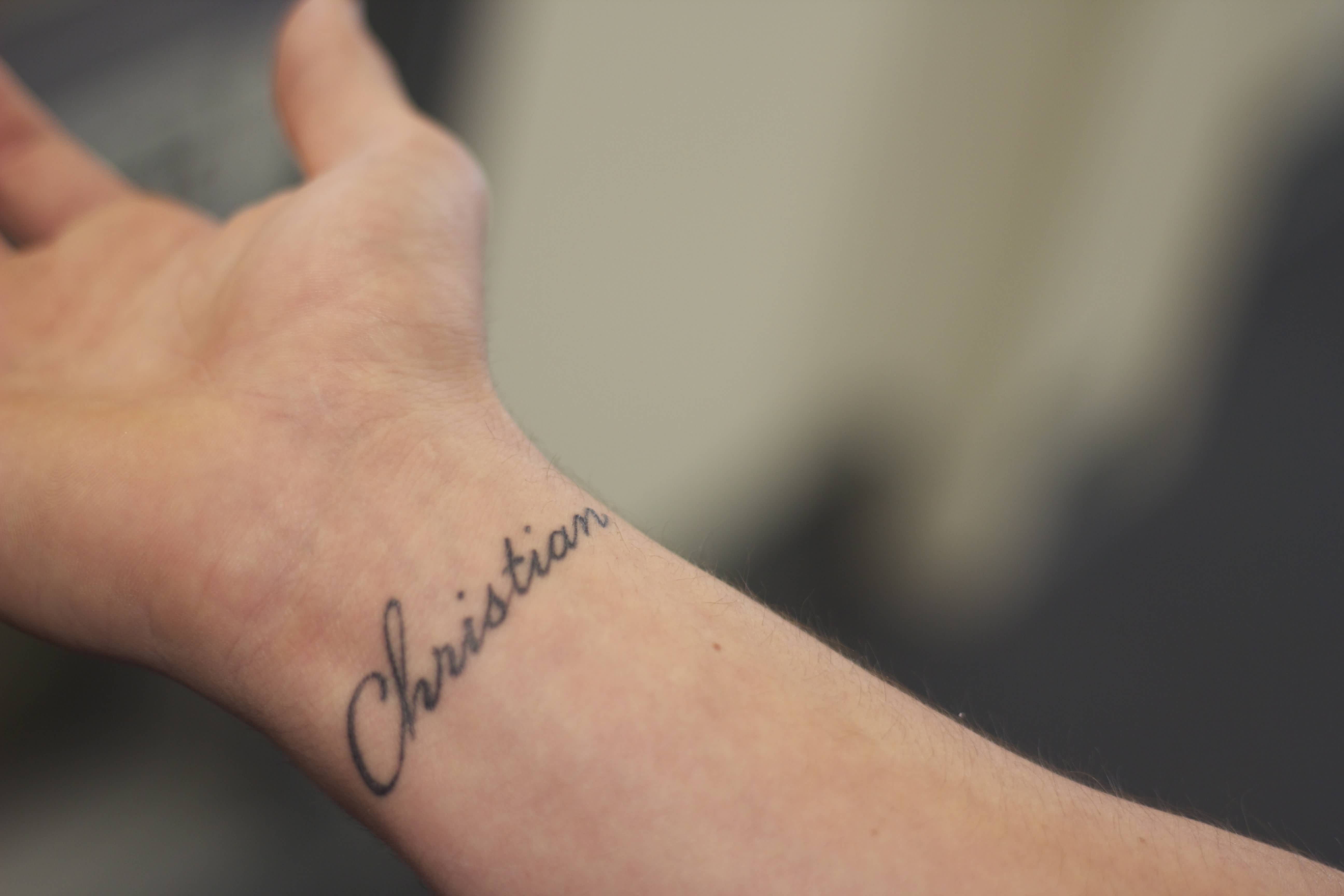 Christian Word Tattoo On Right Wrist