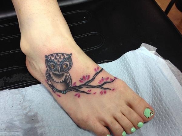 Color Baby Owl On Branch Tattoo On Girl Foot