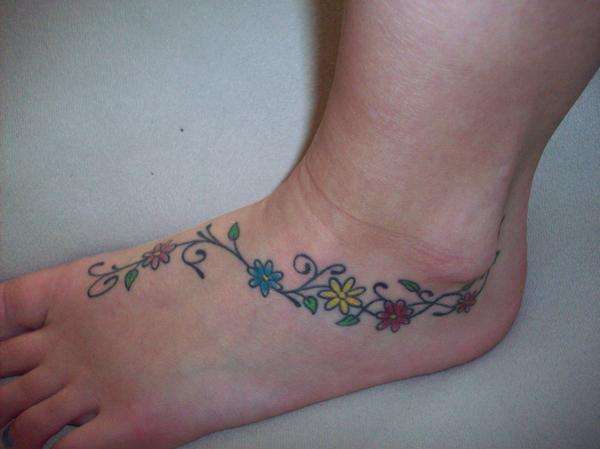 Color Daisy Flowers Tattoo On Left Ankle