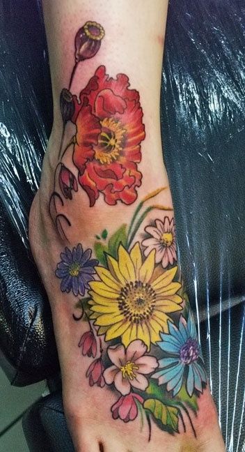 Colored Flowers And Daisy Flower Tattoo On Right Foot