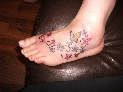 Colorful Butterfly Flowers Tattoo On Foot