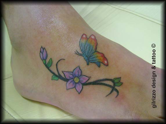 Colorful Butterfly With Flower Tattoo On Foot