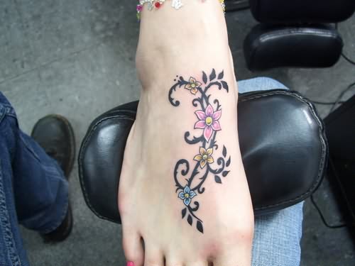 Colorful Floral Vine Tattoo On Foot For Girls