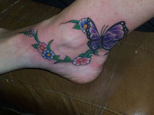 Colorful Flowers With Butterfly Tattoo On Ankle