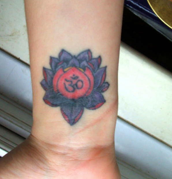 Colorful Om Lotus Religious Tattoo On Man Wrist