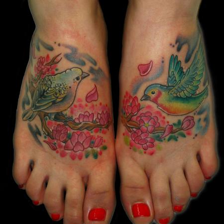 Colorful Two Birds With Flowers Tattoo On Girl Feet