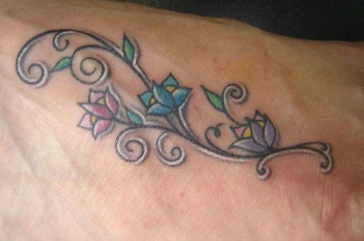 Colorful Vine Flower Tattoo On Foot