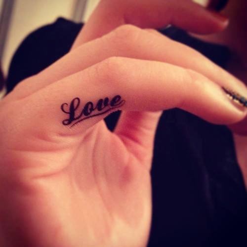 Cool Black Ink Inner Finger Love Word Tattoo For Girls
