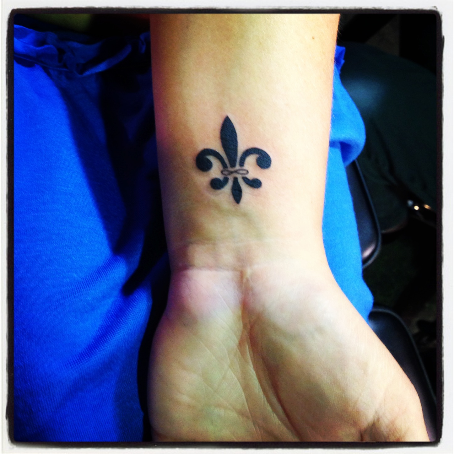 Cool Fleur De Lis Symbol Tattoo On Wrist