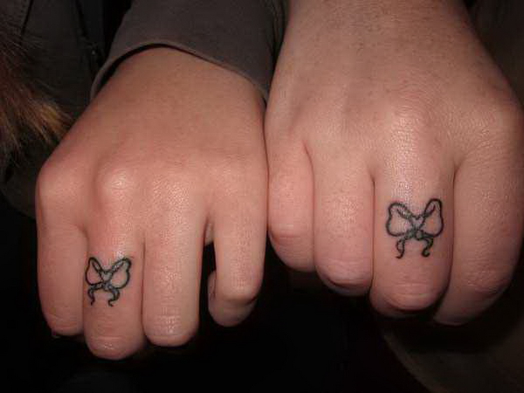 Couple Matching Bow Tattoos On Finger