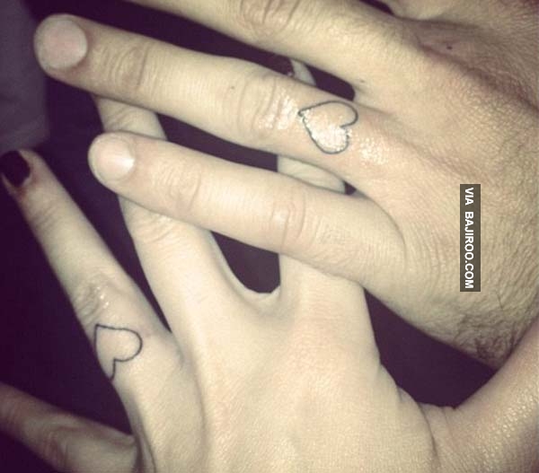 Couple With Outline Heart Tattoos On Fingers