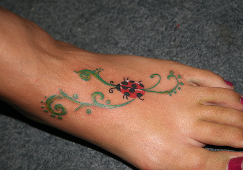 Cute Ladybug On Vine Foot Tattoo For Women