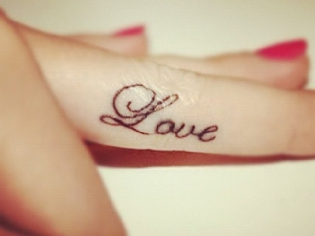Cute Love Word Tattoo On Girly Finger