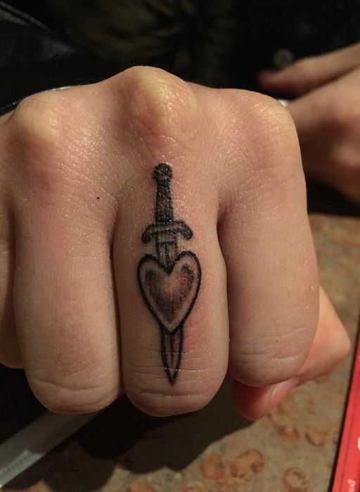 Dagger And Heart Finger Tattoo For Girls